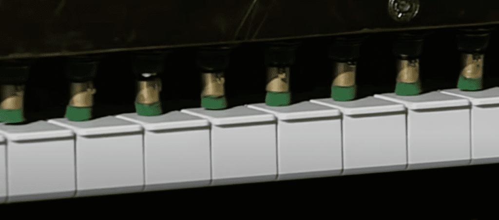 Computerized fingers pressing on Piano keys
